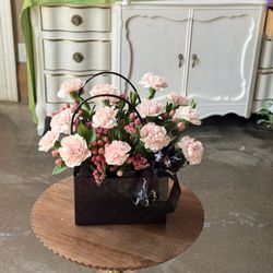 Florida Flowers - Charming studio arrangement -- blush carnations & burgundy berries in a black handled basket. Fresh floral designs by Florida Flowers