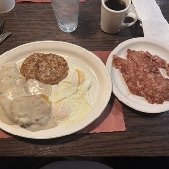 Blueberry Hilltop Cafe - Biscuits and sausage patties with sausage gravy and two over easy eggs and corned beef hash. - Diners Near Me - Mount Pleasant, Wisconsin