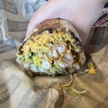 Fat Bastard Burrito - The crispy fish burrito - reference to my hand; it's huge! / IG: Ayeween - Mexican Near Me - Richmond Hill, Ontario
