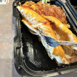 Las Delicias North - There so-called smothered burritos. What you see in the top right corner is not green chili, it's beans out of another burrito.