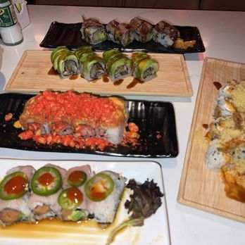 Machi Sushi - Tokyo (bottom), dynamite, dragon, cowboy (top) and Machi (side) specialty rolls. - Sushi Bars Near Me - Austin, Texas Machi Sushi - Tokyo (bottom), dynamite, dragon, cowboy (top) and Machi (side) specialty rolls. - Sushi Bars Near Me - Austin, Texas