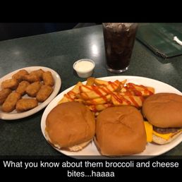 a plate of food and a glass of soda a plate of food and a glass of soda