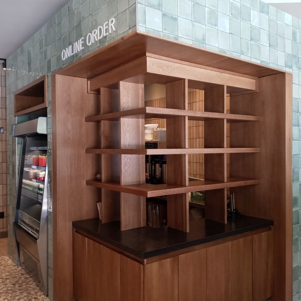 FARE - a coffee shop with wooden shelves - New American Near Me - Chicago, Illinois