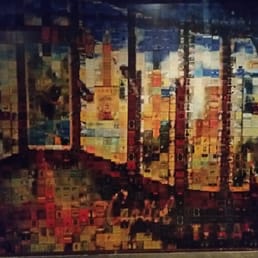 Great mural collage on the wall of many individual wine labels.