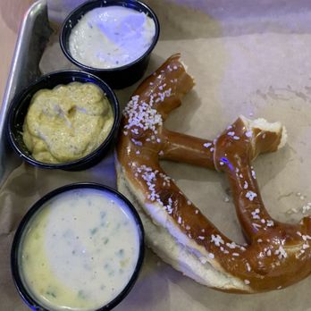 Community Burger - Hard and dry pretzel and pub cheese served cold (bottom). Also brown mustard and sour cream and horseradish sauce (top). - Burgers Near Me - Canton, Georgia Community Burger - Hard and dry pretzel and pub cheese served cold (bottom). Also brown mustard and sour cream and horseradish sauce (top). - Burgers Near Me - Canton, Georgia