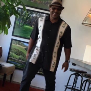 Wine Tour Drivers - a man standing in a living room - Wine Tours Near Me Wine Tour Drivers - a man standing in a living room - Wine Tours Near Me