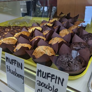Georgetown Donuts - a display of muffins and chocolate cakes - Donuts Near Me - Georgetown, Texas