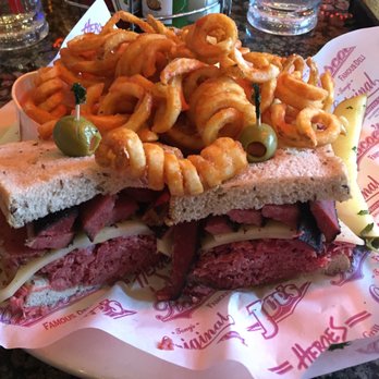 Heroes - Corn beef and pastrami sandwich with some of the best curly fries I have ever had. A must try! - American Near Me - Riverside, California Heroes - Corn beef and pastrami sandwich with some of the best curly fries I have ever had. A must try! - American Near Me - Riverside, California