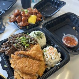 Chicken katsu and bbq beef, spicy chicken in the back Chicken katsu and bbq beef, spicy chicken in the back