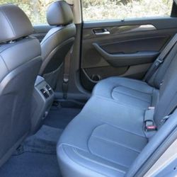 Exceptionally clean backseat of taxicab town car.