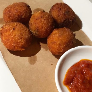 Felice Roslyn - Arancini rice balls, tomato, mozzarella, oregano, served with arrabbiata sauce - Venues & Event Spaces Near Me - Roslyn, New York Felice Roslyn - Arancini rice balls, tomato, mozzarella, oregano, served with arrabbiata sauce - Venues & Event Spaces Near Me - Roslyn, New York