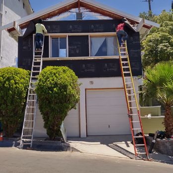 KRN Construction & Remodeling - Covering heat reflective sheeting with tar paper. - General Contractors Near Me - Topanga, California KRN Construction & Remodeling - Covering heat reflective sheeting with tar paper. - General Contractors Near Me - Topanga, California