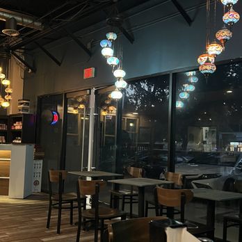 Habibi Cafe - One of the seating areas inside by the entrance. - Hookah Bars Near Me - San Antonio, Texas