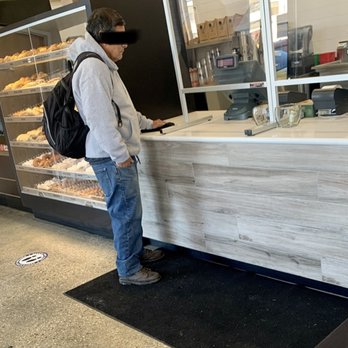 Donut Delight - Man not wearing a mask and not standing behind plexiglass barrier - Coffee & Tea Near Me - Stamford, Connecticut Donut Delight - Man not wearing a mask and not standing behind plexiglass barrier - Coffee & Tea Near Me - Stamford, Connecticut