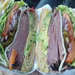Pastrami sandwich with avocado and jalapeños. I get extra pastrami. Absolutely finger licking delicious.