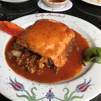 Cafe Istanbul - Mousakka $16.95 Minced beef & lamb layered between slices of eggplant and topped with a bechamel sauce. Finished with mozzarella cheese - Turkish Near Me - Columbus, Ohio Cafe Istanbul - Mousakka $16.95 Minced beef & lamb layered between slices of eggplant and topped with a bechamel sauce. Finished with mozzarella cheese - Turkish Near Me - Columbus, Ohio