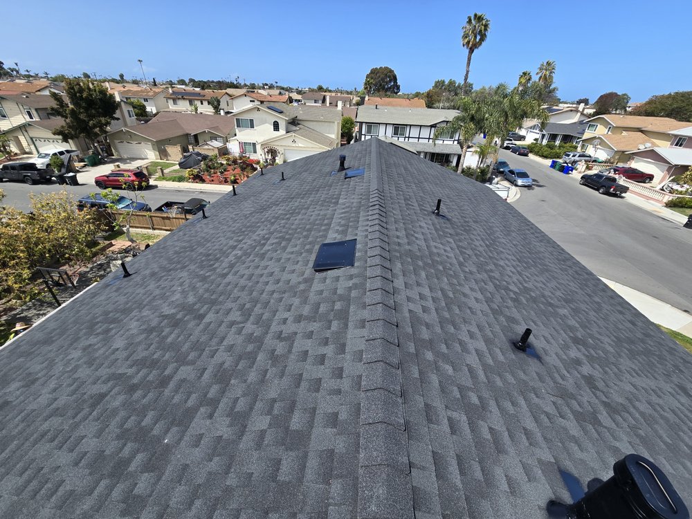 Slide of J&E Roofing Services