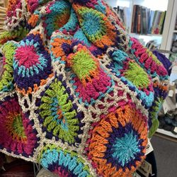 Wool-Tyme - This crochet blanket is on display at Wool Tyme today. I've done a similar pattern in knitting; would like to try it in crochet.
