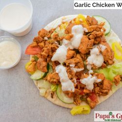 Garlic chicken wrap comes with creamy tzatziki & fresh veggies.