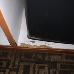 Mt Hood Oregon Resort - Cabinet containing the fridge all broken off. Carpet is holding all kinds of smells, didn't dare take shoes off anywhere in room.