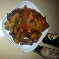 203 Restaurant & Wine Bar - Garnished Tilapia fish and fried plantains.....lip-smacking good