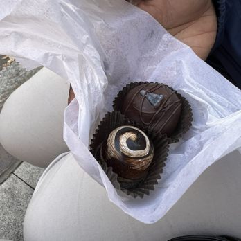 The Chocolate Fetish - a person holding a piece of chocolate - Chocolatiers & Shops Near Me - Asheville, North Carolina The Chocolate Fetish - a person holding a piece of chocolate - Chocolatiers & Shops Near Me - Asheville, North Carolina