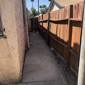 Artistic Tree Services Corp. - Yes there is concrete back there lol the trees and broken fence blocked that - Tree Services Near Me Artistic Tree Services Corp. - Yes there is concrete back there lol the trees and broken fence blocked that - Tree Services Near Me