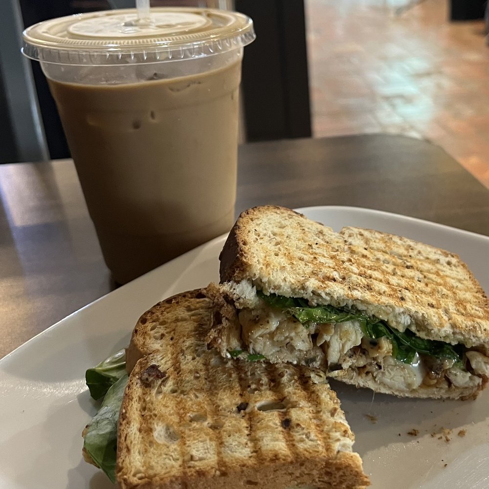 Chicken pesto sandwich and iced coffee Chicken pesto sandwich and iced coffee