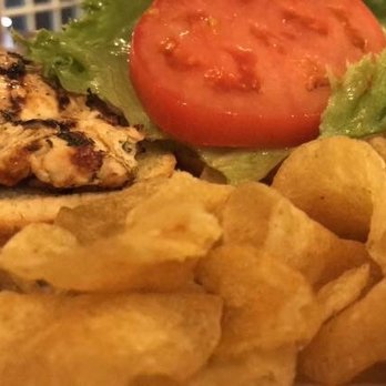 Two Lakes Tavern - a chicken sandwich with chips and tomato - American Near Me - Manitou Beach, Michigan Two Lakes Tavern - a chicken sandwich with chips and tomato - American Near Me - Manitou Beach, Michigan
