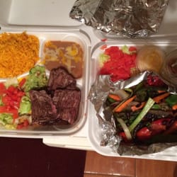 Amigos Mexican-Spanish Restaurant II - Veggie fajitas on the right and carne asada on the left. Beans are verrrry blended, basically soup.