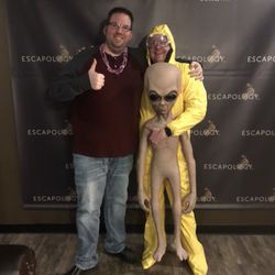Escapology Escape Rooms Butte - After a private birthday party, two guest stop and pose for a picture!