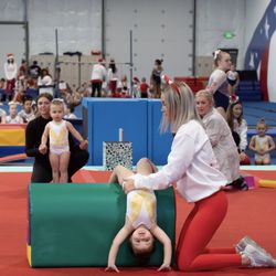 American Gymnastics Academy Northwest - Coach Faith and a Sweet Pea performing an obstacle course during the 2022 Holiday Show.