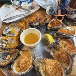Half and half baked oysters: Parmesan and spicy Lafitte Half and half baked oysters: Parmesan and spicy Lafitte