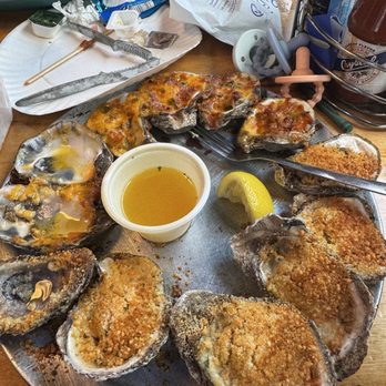 Peg Leg Pete's - Half and half baked oysters: Parmesan and spicy Lafitte - Seafood Near Me - Pensacola Beach, Florida Peg Leg Pete's - Half and half baked oysters: Parmesan and spicy Lafitte - Seafood Near Me - Pensacola Beach, Florida