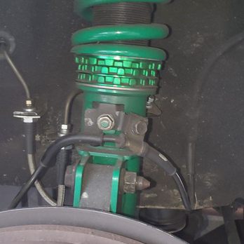 Action Auto - The left side coilover is bottomed out completely!  There is no space at all between the rings!  How could they miss that!!!?? - Auto Repair Near Me - Cypress, California