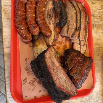 Terry Black's Barbecue - Small family platter plus Dino rib - Barbeque Near Me - Fort Worth, Texas Terry Black's Barbecue - Small family platter plus Dino rib - Barbeque Near Me - Fort Worth, Texas