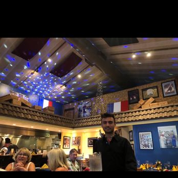 Bleu Rendezvous French Bistro - Dining room and our fabulous server! - French Near Me - Sanibel, Florida Bleu Rendezvous French Bistro - Dining room and our fabulous server! - French Near Me - Sanibel, Florida