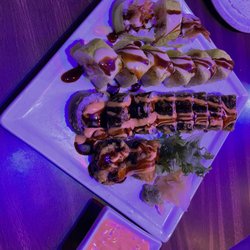 Tokyo Japanese Steakhouse & Sushi - Fort Gratiot Roll (green-yellow roll) Delicious Roll (Black roll)