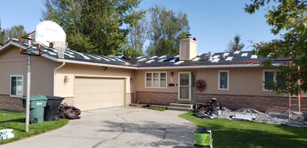 Slide of Osman Roofing Company