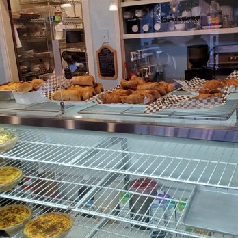 The North Bend Bakery - Savory section in morning w clear plastic covering over food - Bakeries Near Me - North Bend, Washington The North Bend Bakery - Savory section in morning w clear plastic covering over food - Bakeries Near Me - North Bend, Washington