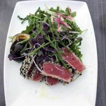 Rock's Landing - Ahi tuna, with soy-marinated boiled egg, arugula, and peppers in a ginger vinagarette sauce. - New American Near Me - Frankfort, Michigan Rock's Landing - Ahi tuna, with soy-marinated boiled egg, arugula, and peppers in a ginger vinagarette sauce. - New American Near Me - Frankfort, Michigan