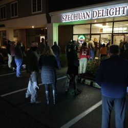 Szechuan Delight - Masked crowd waiting for their Christmas Eve Chinese food take out orders