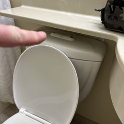 Stay Beyond Inn & Suites - Shelf is built over the toilet level