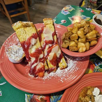 The Flying Biscuit Cafe - Strawberry Cheesecake Stuffed French Toast with a side of potatoes - Breakfast & Brunch Near Me - Houston, Texas The Flying Biscuit Cafe - Strawberry Cheesecake Stuffed French Toast with a side of potatoes - Breakfast & Brunch Near Me - Houston, Texas