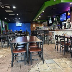 Guacamoles Mexican Grill & Cantina - Interior - clean and neat even though the floors bring the appeal down a little bit.