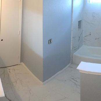 Yes Home Remodeling - a bathroom with a tub and sink - Foundation Repair Near Me - Dallas, Texas Yes Home Remodeling - a bathroom with a tub and sink - Foundation Repair Near Me - Dallas, Texas