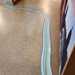 Greenwich Tourist Information Centre - Part of the River Thames map embedded in the floor