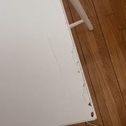 Dining table surface cracked and stripped from dragging during move Dining table surface cracked and stripped from dragging during move