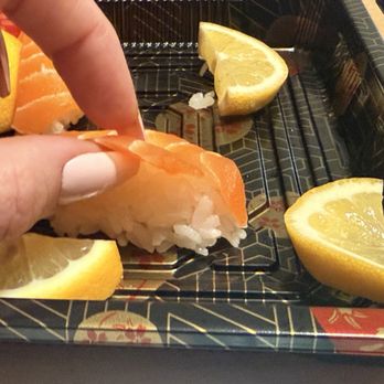 Gorilla Eats Sushi - Showing how thin the slices of salmon are, paired with so much rice. Not worth the price at all. - Sushi Bars Near Me - San Diego, California Gorilla Eats Sushi - Showing how thin the slices of salmon are, paired with so much rice. Not worth the price at all. - Sushi Bars Near Me - San Diego, California