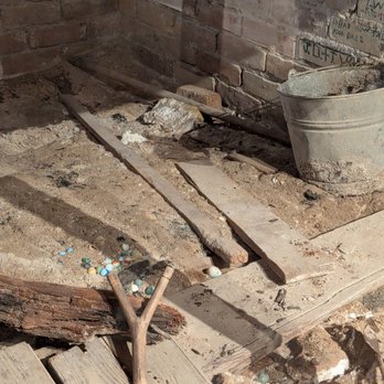 The Bryan Museum - Under the staircase was left undisturbed. The bricks have many writtings from the kids including a poem " no mom ,no dad,so sad" - Museums Near Me - Galveston, Texas
